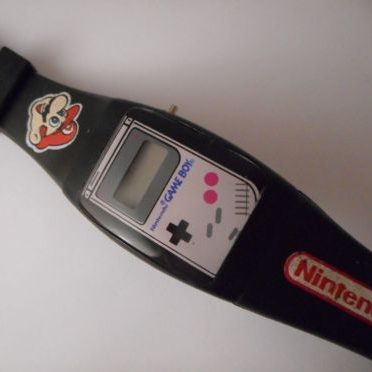 Vintage Nintendo watch with N64 logo on it